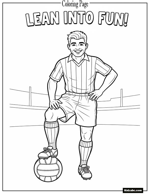 Footballer leaning on ball smiling