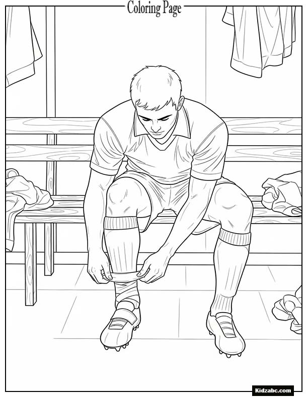 Footballer sitting on bench tying tape on ankles